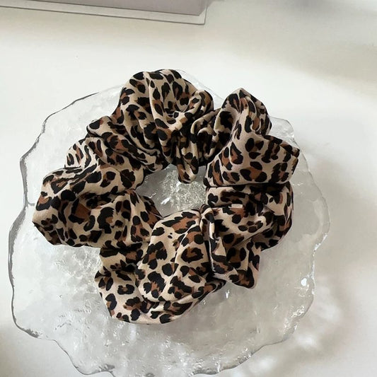 Leopard print scrunchies matching dog harness for dog mom