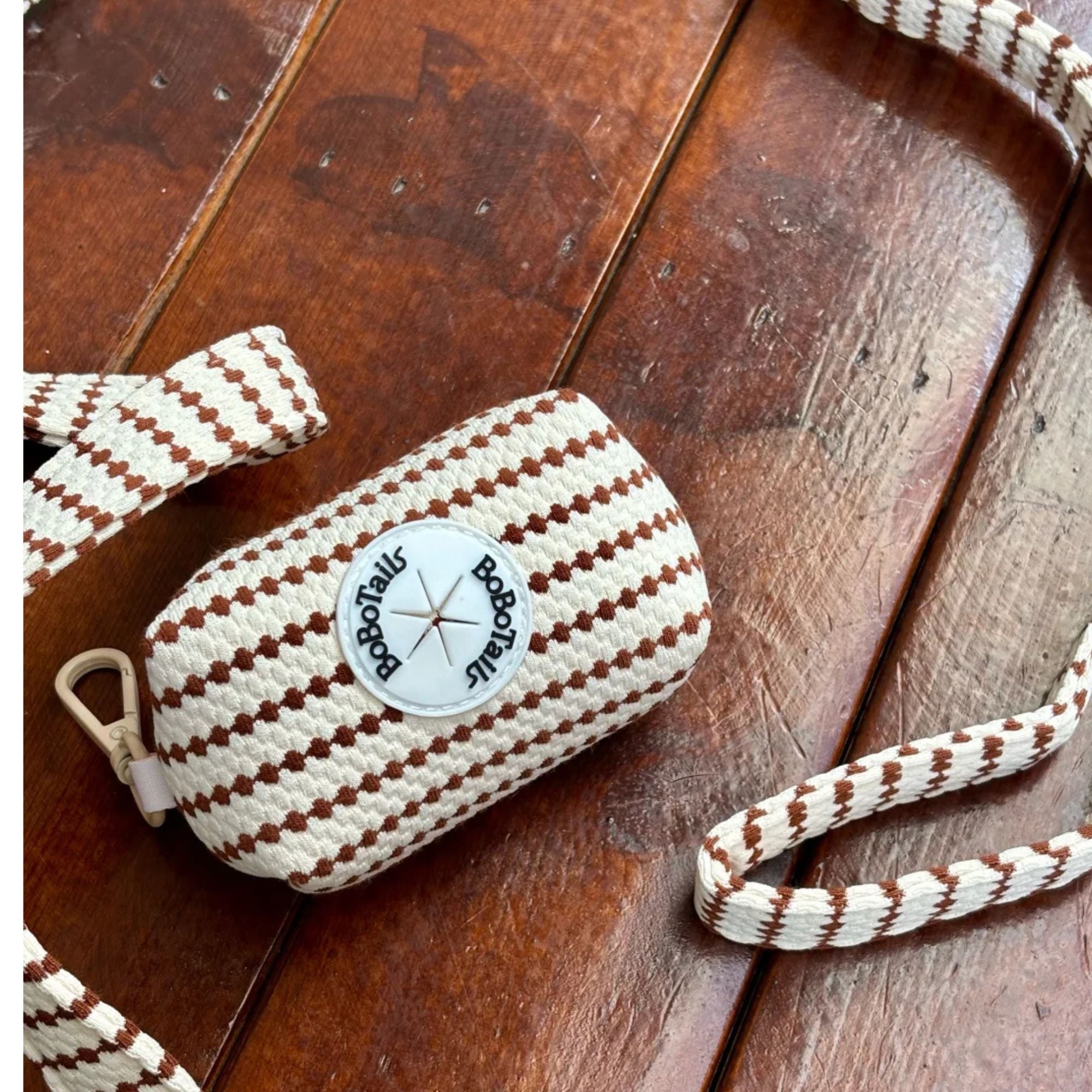small grain dog poop bag holder matching the leopard harness and owner accessories for daily dog walks