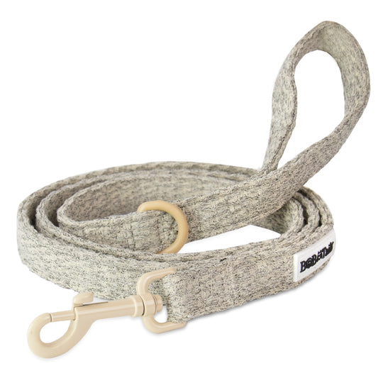 Taupe chunky knitted  dog leash with a soft loop handle and sturdy hardware.