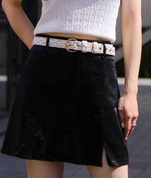a woman wearing floral brilliance women's designer belts showing texture and craftsmanship designed for comfort