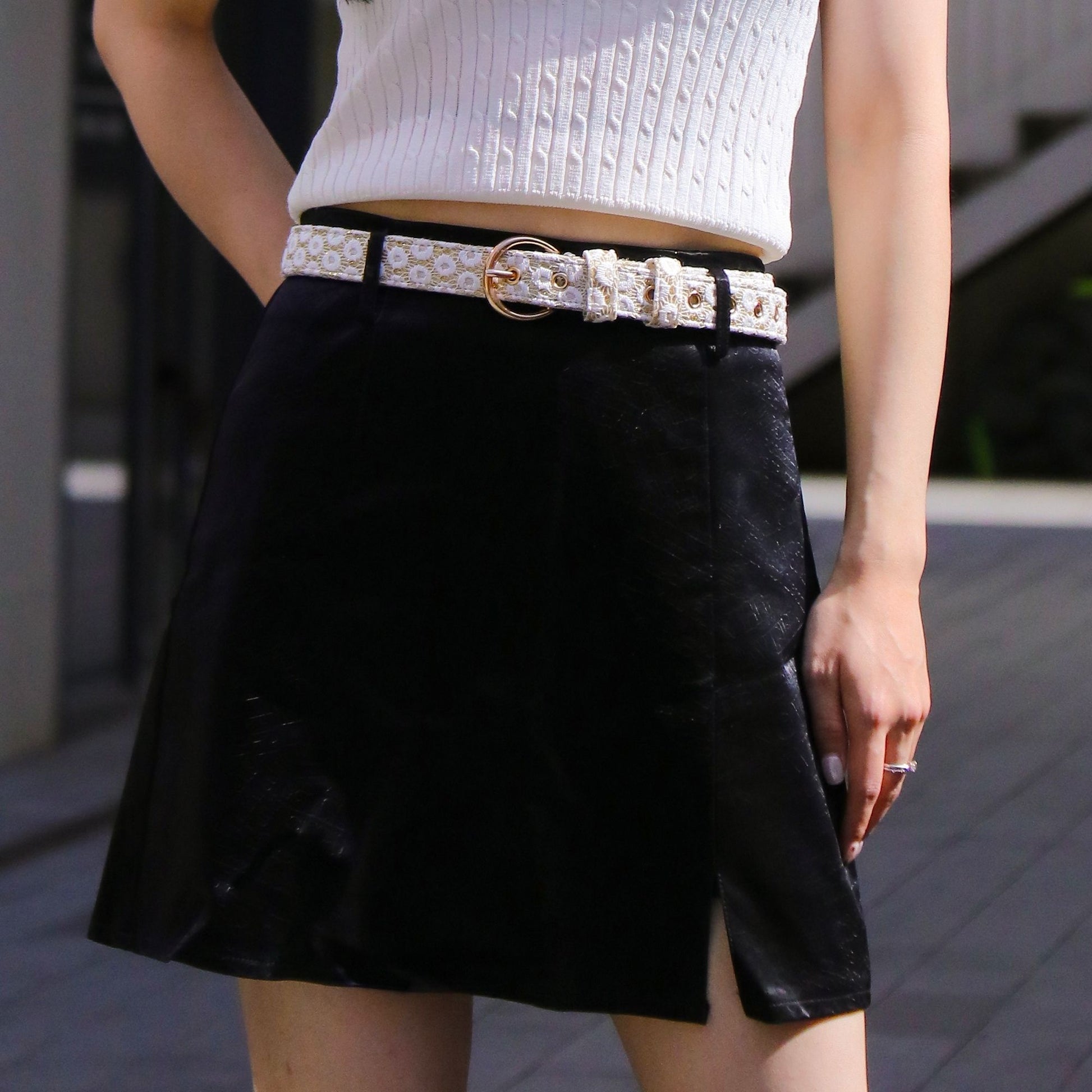a woman wearing floral brilliance women's designer belts showing texture and craftsmanship designed for comfort