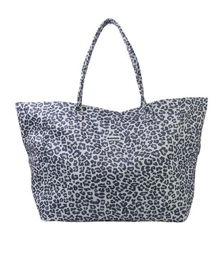 A canvas tote bag with a navy blue leopard print pattern on a white background, featuring two shoulder straps.