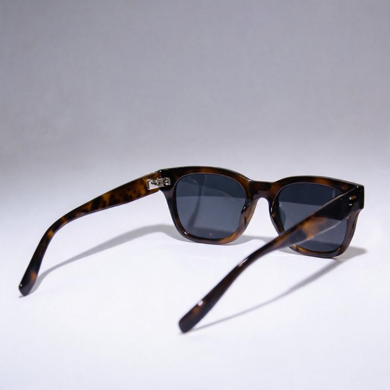 A pair of classic-style Bobotails leopard sunglasses with a dark brown tortoiseshell acetate frame and dark gray lenses, displayed on a clean light gray background.