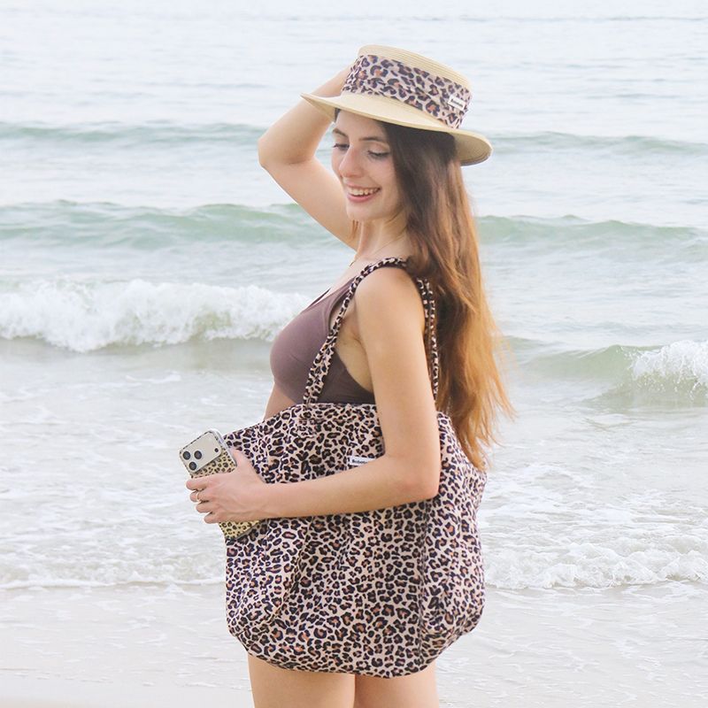 Stylish leopard shoulder tote bag combining fashion and functionality for active dog parents.