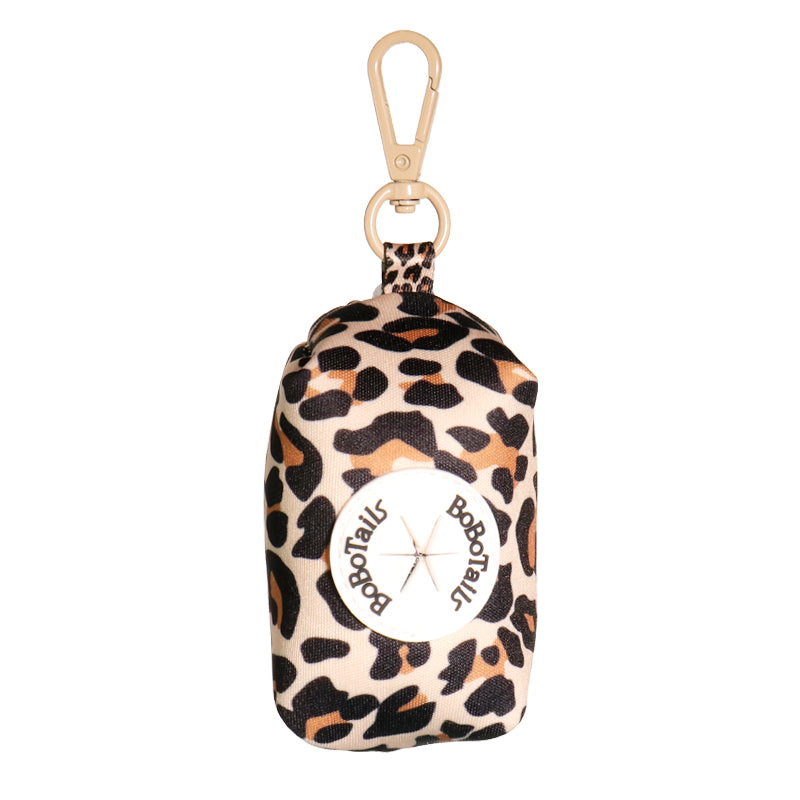 leopard printed dog poop bag holder matching the leopard harness and owner accessories for daily dog walks
