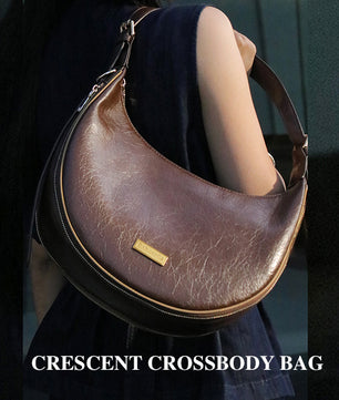Brown leather crescent crossbody bag for pet mom