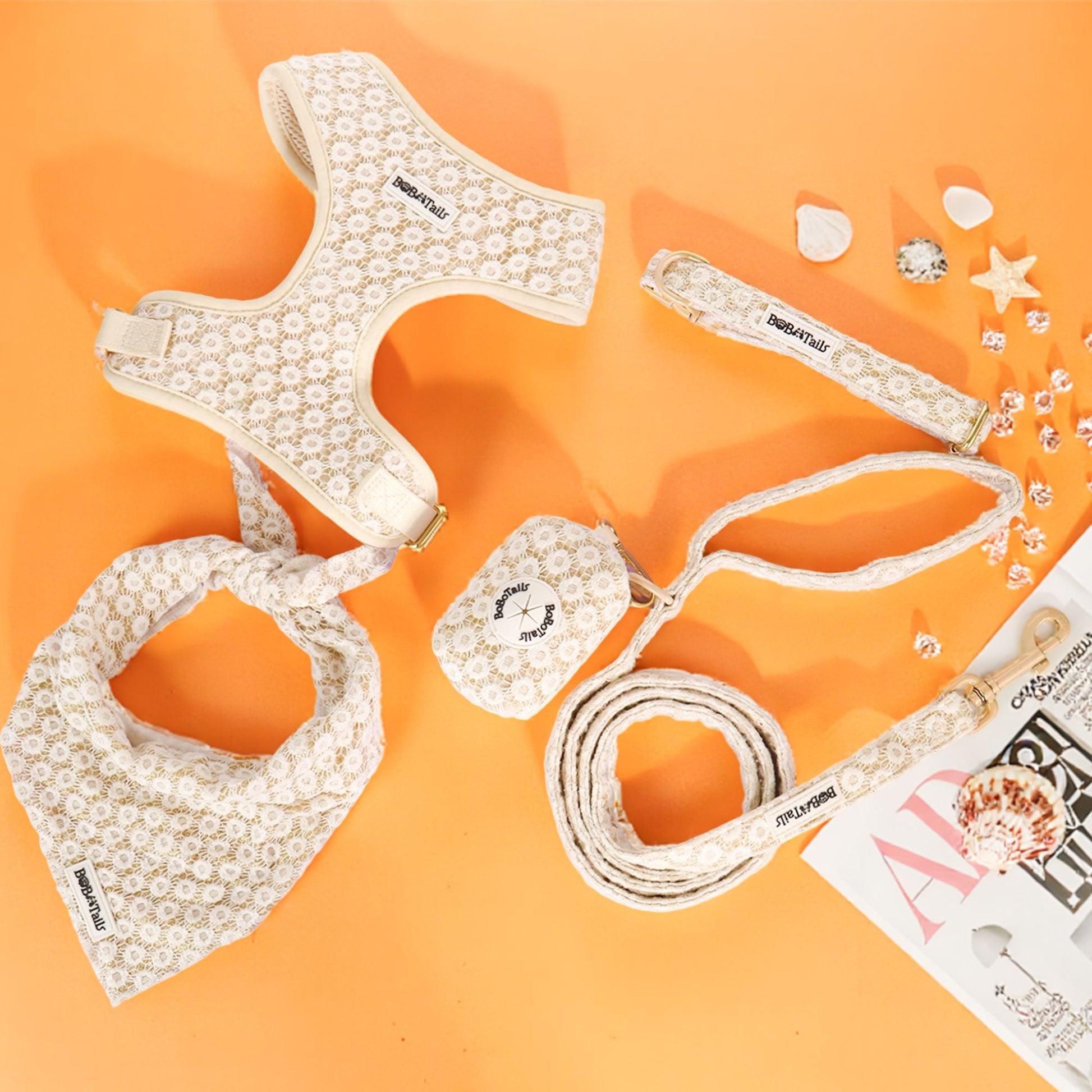 floral brilliance Dog harness, leash, and bandana set on an orange background with decorative elements.-bobotails